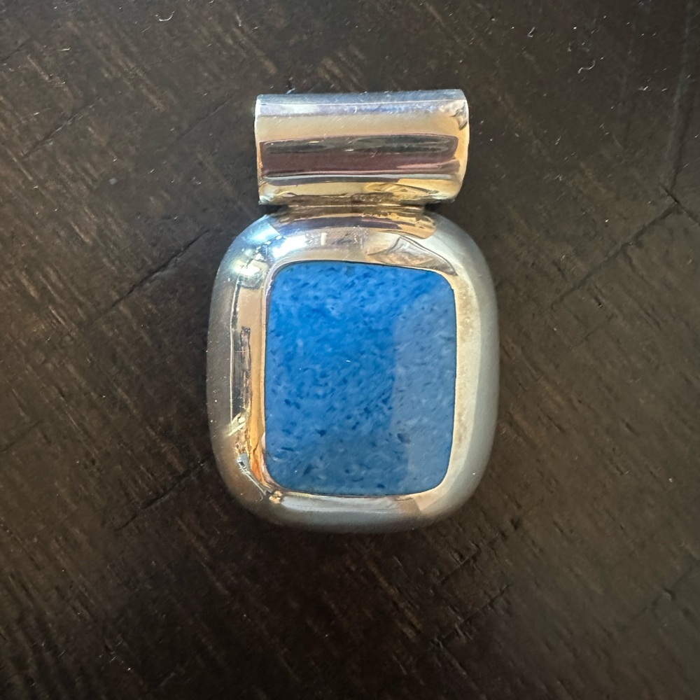 Modern Silver and Blue Brooch with Sleek Design